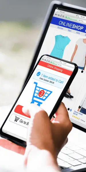 A cellphone and a laptop with an image of an add-to-cart