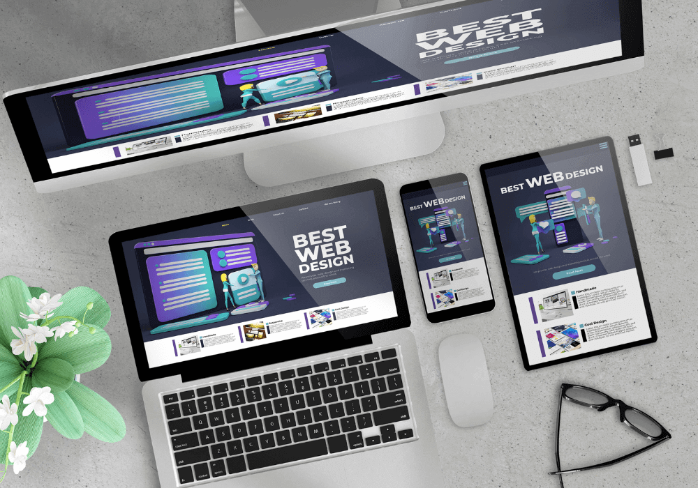 An image of a cellphone, tablet, laptop, mouse, eyeglass, usb, and monitor